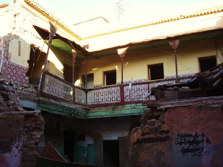 A bedroom, shutters half open